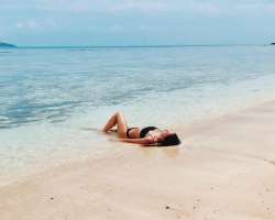 She likes to enjoy and relaxing at beaches.